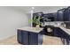 Stylish kitchen featuring dark blue cabinetry and a large kitchen island at 2528 W Brookhart Way, Phoenix, AZ 85085