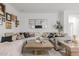 Elegant living room boasting a sectional sofa and a gallery wall at 2528 W Brookhart Way, Phoenix, AZ 85085