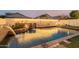 Expansive pool area with a serene atmosphere and beautiful lighting at 2528 W Brookhart Way, Phoenix, AZ 85085