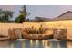 Stunning pool detail with cascading water features and ambient lighting at 2528 W Brookhart Way, Phoenix, AZ 85085