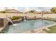 Inviting backyard pool with waterfall feature and spacious patio at 2528 W Brookhart Way, Phoenix, AZ 85085