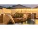 Close-up view of the elegant water feature in the pool area at 2528 W Brookhart Way, Phoenix, AZ 85085