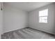 Simple bedroom with carpeted floor and large window at 2575 E Bluff Spring Ave, Apache Junction, AZ 85119