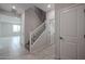 Modern staircase with simple white railings and neutral wall colors at 2575 E Bluff Spring Ave, Apache Junction, AZ 85119