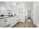 Modern bathroom with double vanity, soaking tub, and walk-in shower at 2693 S 357Th Dr, Tonopah, AZ 85354