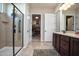 Bathroom with double vanity and walk-in shower at 27028 W Oraibi Dr, Buckeye, AZ 85396