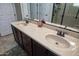 Double vanity bathroom with granite countertops at 27028 W Oraibi Dr, Buckeye, AZ 85396