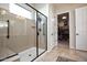 Bathroom with walk-in shower and spacious closet at 27028 W Oraibi Dr, Buckeye, AZ 85396