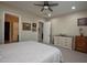 King-size bed, en-suite bathroom and walk-in closet at 27028 W Oraibi Dr, Buckeye, AZ 85396