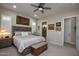 Bright bedroom with a king-size bed and en-suite bathroom at 27028 W Oraibi Dr, Buckeye, AZ 85396