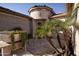 Inviting courtyard entry with palm trees and stone flooring at 27028 W Oraibi Dr, Buckeye, AZ 85396