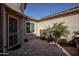 Private courtyard with a charming entrance and lush plants at 27028 W Oraibi Dr, Buckeye, AZ 85396