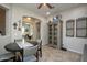 Casual dining area with round table, chairs, and decorative shelving at 27028 W Oraibi Dr, Buckeye, AZ 85396