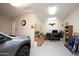 Garage workshop area with cabinets and workbench at 27028 W Oraibi Dr, Buckeye, AZ 85396