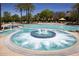 Relaxing hot tub surrounded by a beautiful pool area at 27028 W Oraibi Dr, Buckeye, AZ 85396