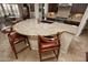 Large kitchen island with granite countertop and custom wooden stools at 27028 W Oraibi Dr, Buckeye, AZ 85396