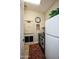 Laundry room with washer, dryer, and extra storage at 27028 W Oraibi Dr, Buckeye, AZ 85396