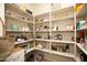 Well-organized pantry with plenty of shelving for storage at 27028 W Oraibi Dr, Buckeye, AZ 85396