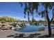 Landscaped pond with waterfall and lush greenery at 27028 W Oraibi Dr, Buckeye, AZ 85396