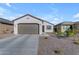 Single-story home with a two-car garage and landscaped front yard at 2732 E Trail Blazer Dr, San Tan Valley, AZ 85140