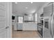 Modern kitchen with island, stainless steel appliances, and white cabinets at 2732 E Trail Blazer Dr, San Tan Valley, AZ 85140