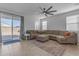 Living room with large sectional sofa and access to backyard at 2732 E Trail Blazer Dr, San Tan Valley, AZ 85140