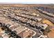 Aerial view of a large residential neighborhood with houses and streets at 2929 E Birdsong Ave, San Tan Valley, AZ 85143