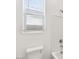 Clean bathroom features a toilet, bathtub, and window with blinds at 2929 E Birdsong Ave, San Tan Valley, AZ 85143