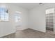 Spacious bedroom with wood-look floors, an adjacent office, and built-in shelving at 2929 E Birdsong Ave, San Tan Valley, AZ 85143