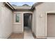 Front entryway with walkway, dark door, and sidelight window at 2929 E Birdsong Ave, San Tan Valley, AZ 85143