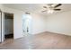 Spacious bedroom featuring wood-look floors and ceiling fan at 2929 E Broadway Rd # 13, Mesa, AZ 85204