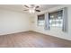 Bright bedroom with wood-look floors and ceiling fan at 2929 E Broadway Rd # 13, Mesa, AZ 85204