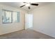 Bedroom with ceiling fan and carpet flooring at 2929 E Broadway Rd # 13, Mesa, AZ 85204