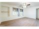 Well-lit bedroom with wood-look floors and ceiling fan at 2929 E Broadway Rd # 13, Mesa, AZ 85204