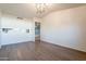 Living room with vaulted ceiling, wood-look floors, and neutral walls at 2929 E Broadway Rd # 13, Mesa, AZ 85204