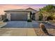 Single-story home with a two-car garage and desert landscaping at 2930 N 154Th Dr, Goodyear, AZ 85395