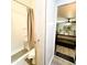 Bathroom with shower, toilet and view of bedroom at 303 N Lindsay Rd # N12, Mesa, AZ 85213