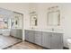 Bathroom featuring a large vanity with dual sinks, walk-in shower, and a soaking tub at 3106 E Hiddenview Dr, Phoenix, AZ 85048