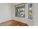 Cozy breakfast nook with a view of the landscaped backyard through large windows at 3106 E Hiddenview Dr, Phoenix, AZ 85048