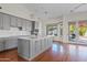 Modern kitchen with gray cabinets, stainless steel appliances, and large center island at 3106 E Hiddenview Dr, Phoenix, AZ 85048