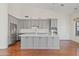 Modern kitchen with gray cabinets, stainless steel appliances, and large center island at 3106 E Hiddenview Dr, Phoenix, AZ 85048