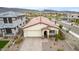 Single-story home with tile roof and driveway at 31817 N 124Th Dr, Peoria, AZ 85383