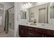 Modern bathroom with double vanity and bathtub at 31817 N 124Th Dr, Peoria, AZ 85383