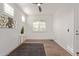 Bright bedroom with wood floors, window shutters, and ceiling fan at 31817 N 124Th Dr, Peoria, AZ 85383