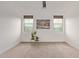 Bright bedroom with carpet, ceiling fan, and large windows at 31817 N 124Th Dr, Peoria, AZ 85383