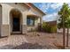 Front entry with a brick walkway, arched entryway and iron railing at 31817 N 124Th Dr, Peoria, AZ 85383