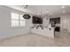 Modern kitchen with dark cabinetry and an island at 31817 N 124Th Dr, Peoria, AZ 85383