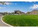 Green lawn with modern clubhouse view at 31817 N 124Th Dr, Peoria, AZ 85383