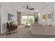 Bright living room with sliding glass doors leading to a patio and mountain views at 31817 N 124Th Dr, Peoria, AZ 85383