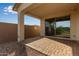 Covered patio with sliding glass doors at 31817 N 124Th Dr, Peoria, AZ 85383